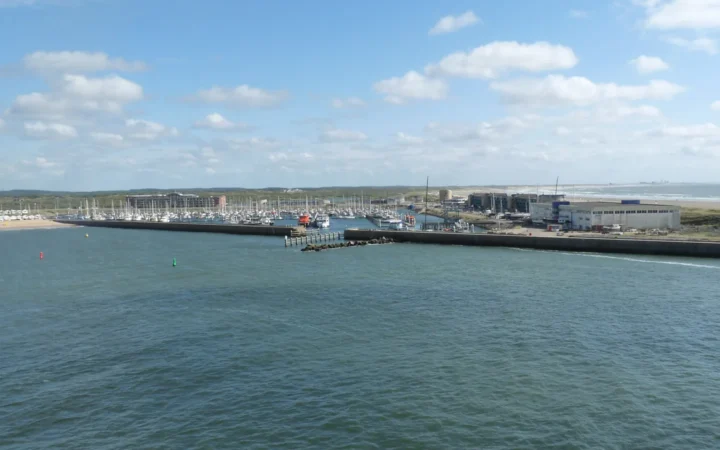 Marina Seaport IJmuiden and the North Sea shoreline across the harbor entrance