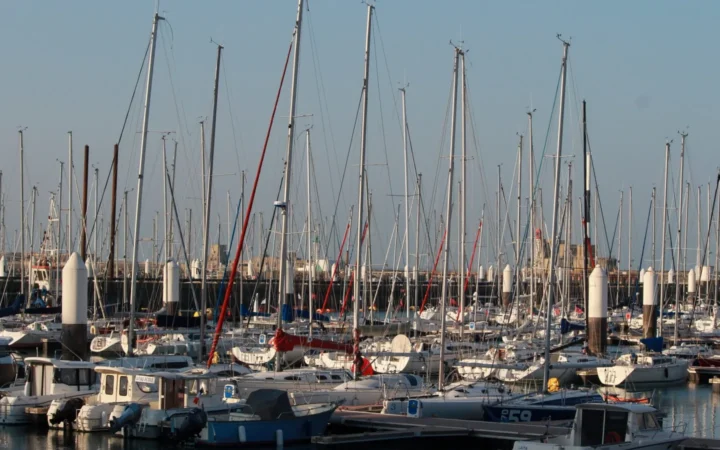 Sailboats in Le Havre Marina with the port skyline beyond