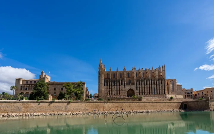 La Seu cathedral and historic waterfront walls beside the water in Palma de Mallorca